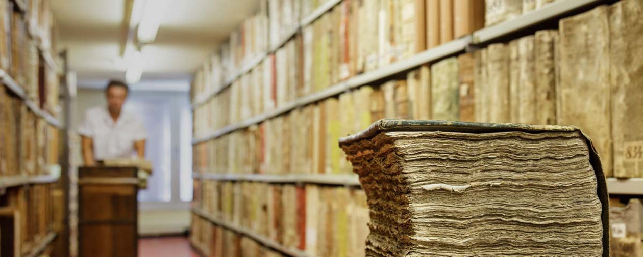 Picture of archives stacks, East Prussian folios from the fifteenth to the nineteenth century in the Geheimes Staatsarchiv PK © SPK / Pierre Adenis. Accessed June 18, 2021 https://www.preussischer-kulturbesitz.de/about-us/profile/?L=1